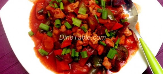 Chicken with vegetable stir fry in tomato, chilli and dark soya sauce