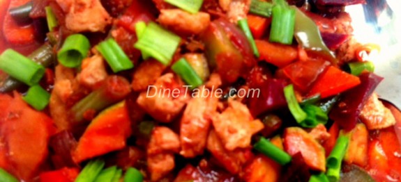 Chicken with vegetable stir fry in tomato, chilli and dark soya sauce